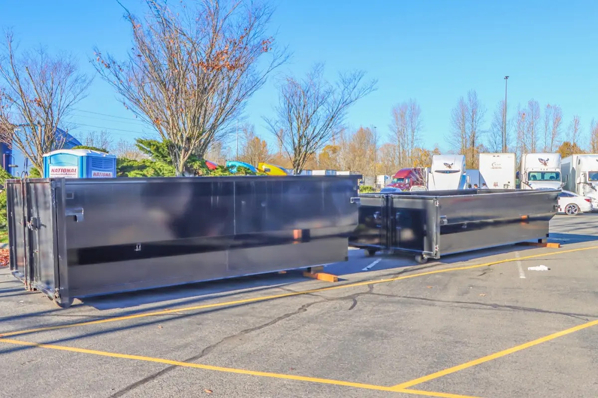 Professional dumpster rental service with roll-off container on residential driveway in Temecula